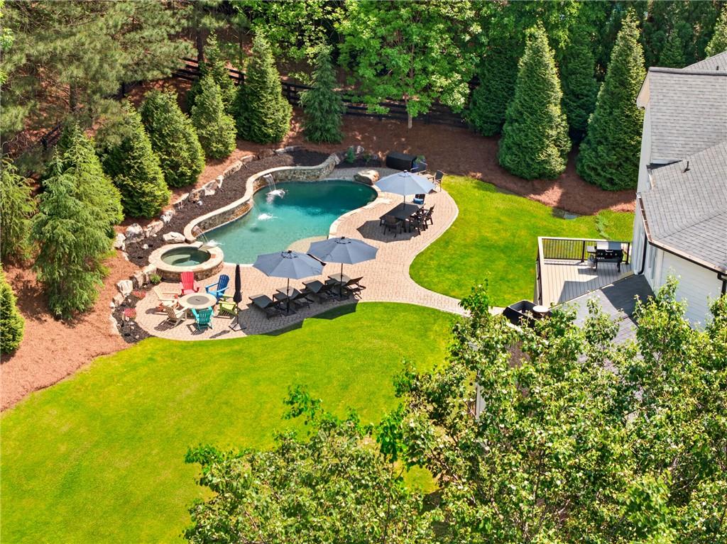 130 Providence Oaks Pointe Milton, GA 30004 - Photo 2 of 89 an aerial view of a house with a garden and swimming pool