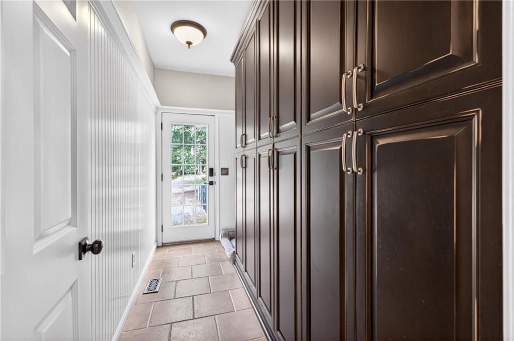 130 Providence Oaks Pointe Milton, GA 30004 - Photo 43 of 89 a view of a hallway with wooden floor
