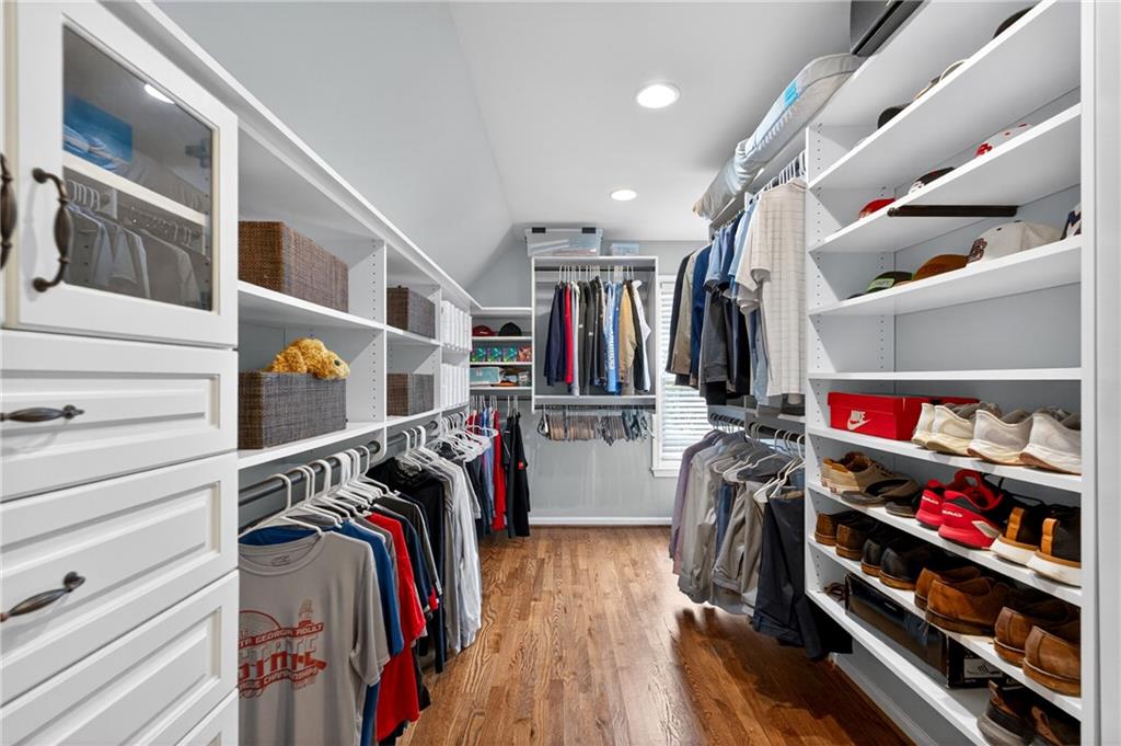 130 Providence Oaks Pointe Milton, GA 30004 - Photo 51 of 89 a view of walk in closet with clothes and shoes