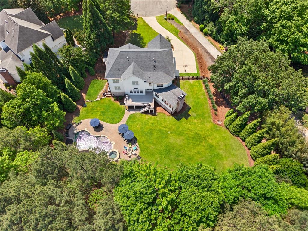 130 Providence Oaks Pointe Milton, GA 30004 - Photo 7 of 89 an aerial view of a house with swimming pool and large trees