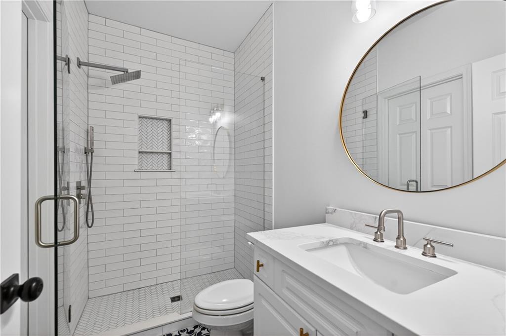 130 Providence Oaks Pointe Milton, GA 30004 - Photo 76 of 89 a bathroom with a sink toilet and shower