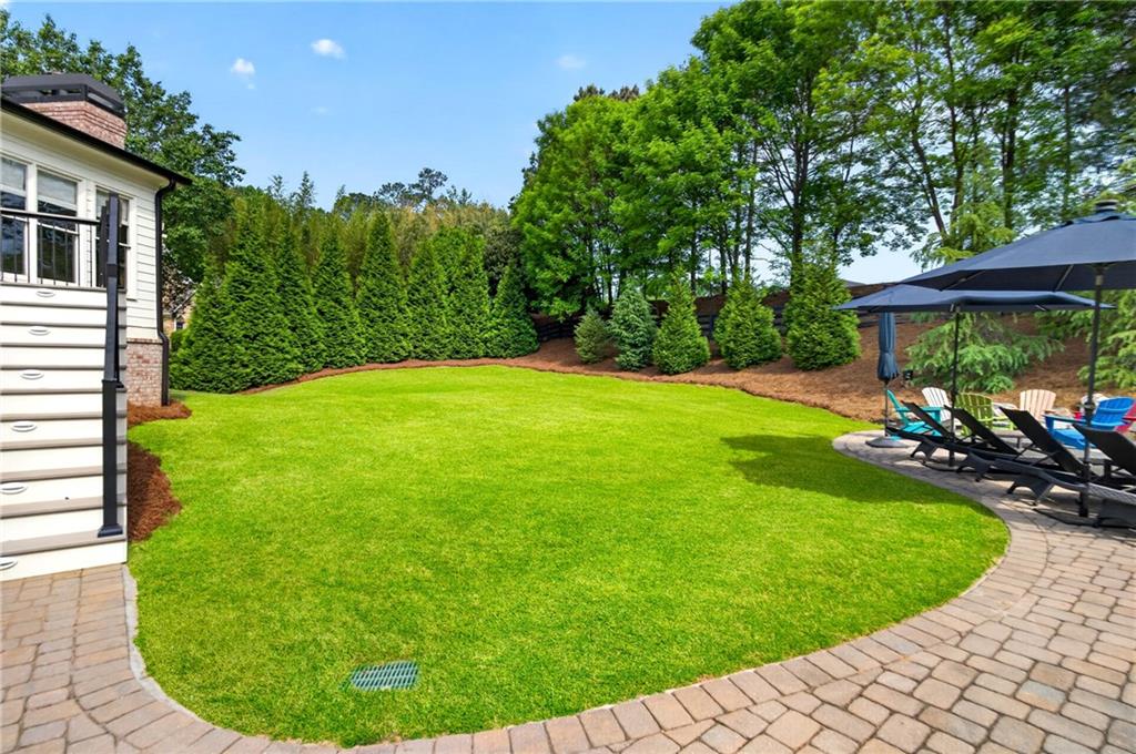 130 Providence Oaks Pointe Milton, GA 30004 - Photo 85 of 89 a view of a backyard with a garden and plants