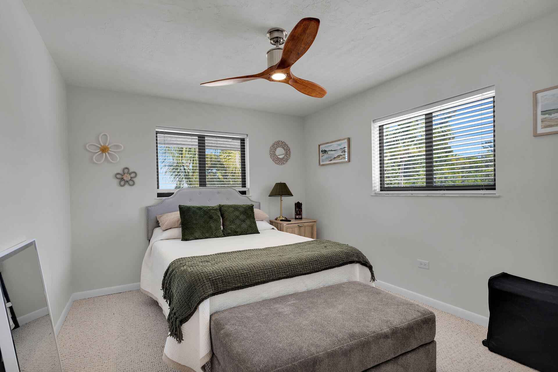 782 Bostwick Drive Key Largo, FL 33037 - Photo 33 of 63 a bedroom with a large bed and a chandelier