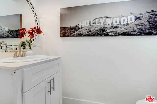 a bathroom with a shower and a glass door