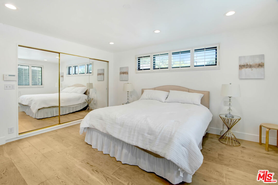 4166 Crisp Canyon Road Sherman Oaks, CA 91403 - Photo 27 of 54 a bedroom with two beds and a night stand