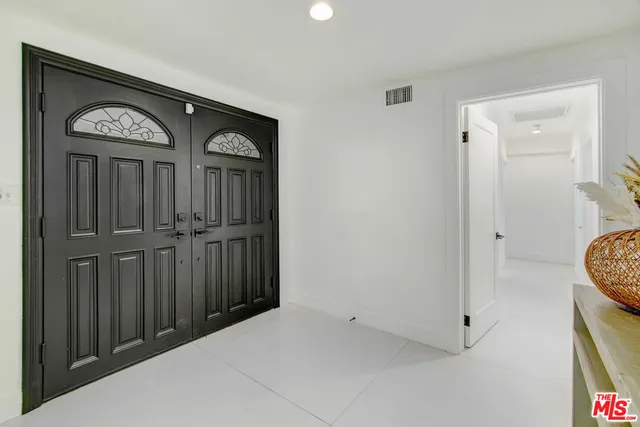 a view of front door with a hallway