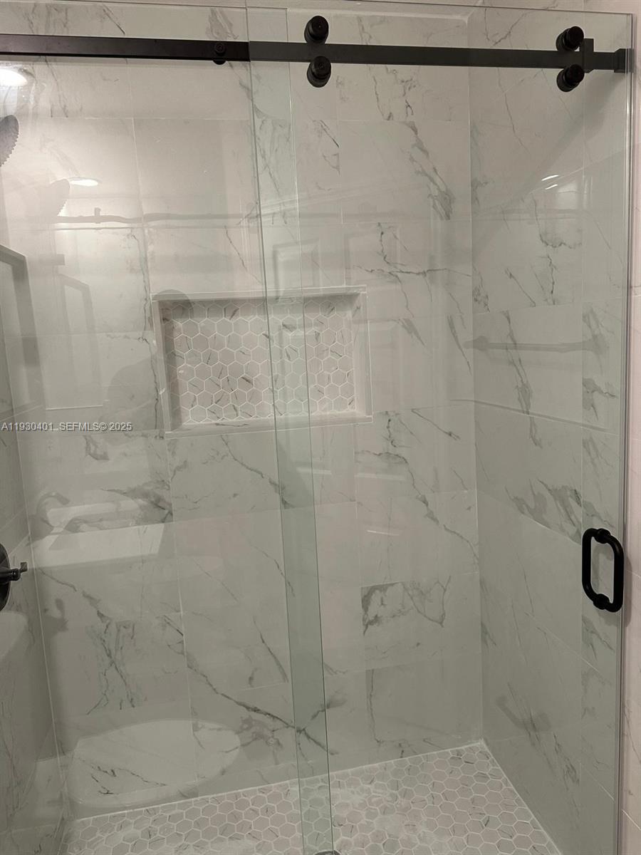 12421 Southwest 50th Court, Unit 337 Miramar, FL 33027 - Photo 38 of 46 a bathroom with a shower