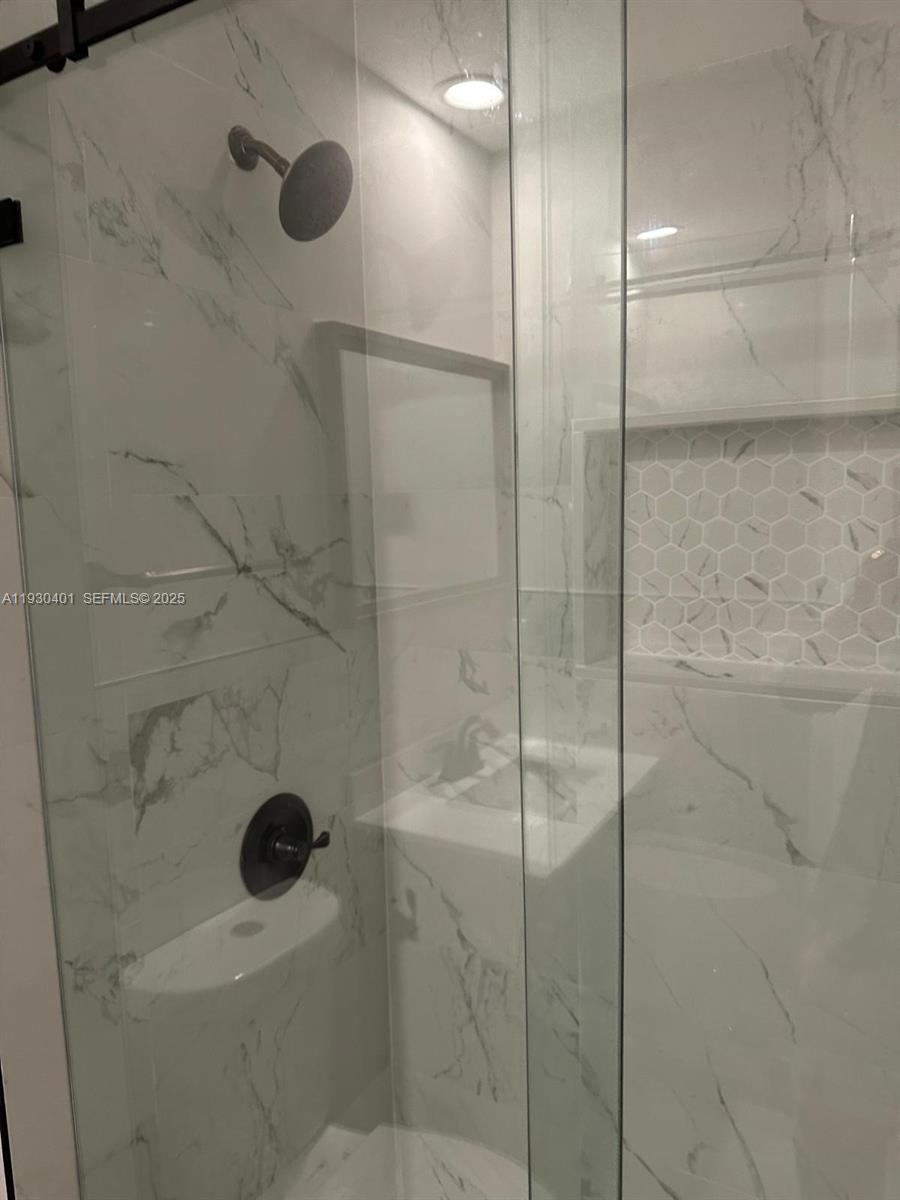 12421 Southwest 50th Court, Unit 337 Miramar, FL 33027 - Photo 39 of 46 a bathroom with a shower