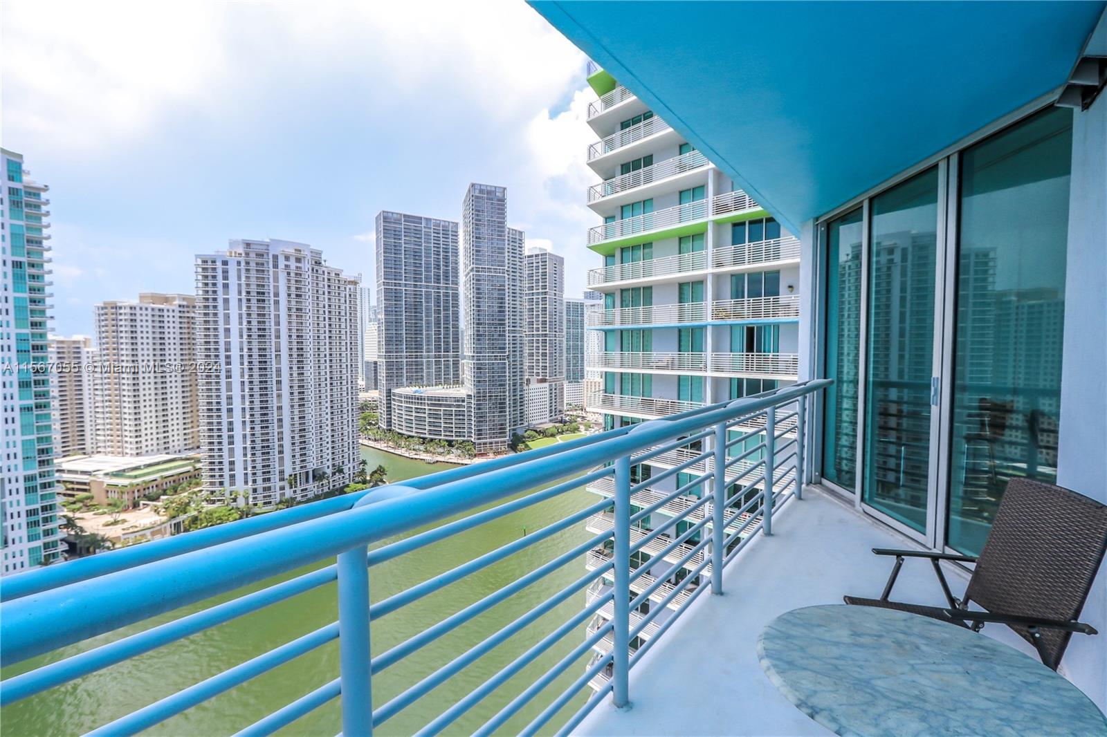 335 South Biscayne Boulevard, Unit 2703 Miami, FL 33131 - Photo 2 of 55 a view of balcony with a potted plant and outdoor seating