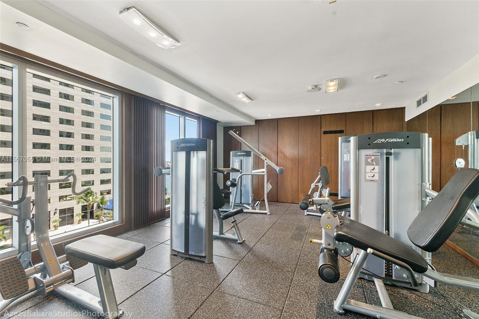 335 South Biscayne Boulevard, Unit 2703 Miami, FL 33131 - Photo 36 of 55 a view of a room with gym equipment
