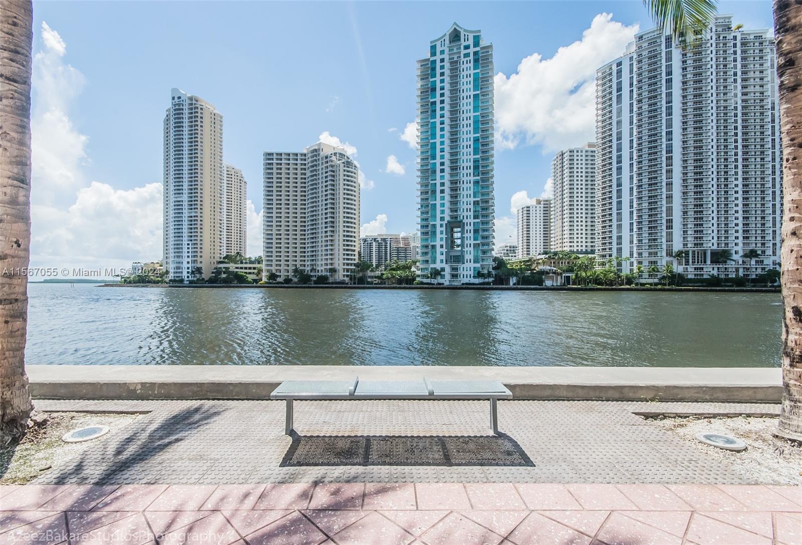 335 South Biscayne Boulevard, Unit 2703 Miami, FL 33131 - Photo 53 of 55 a view of a lake with tall buildings in the background