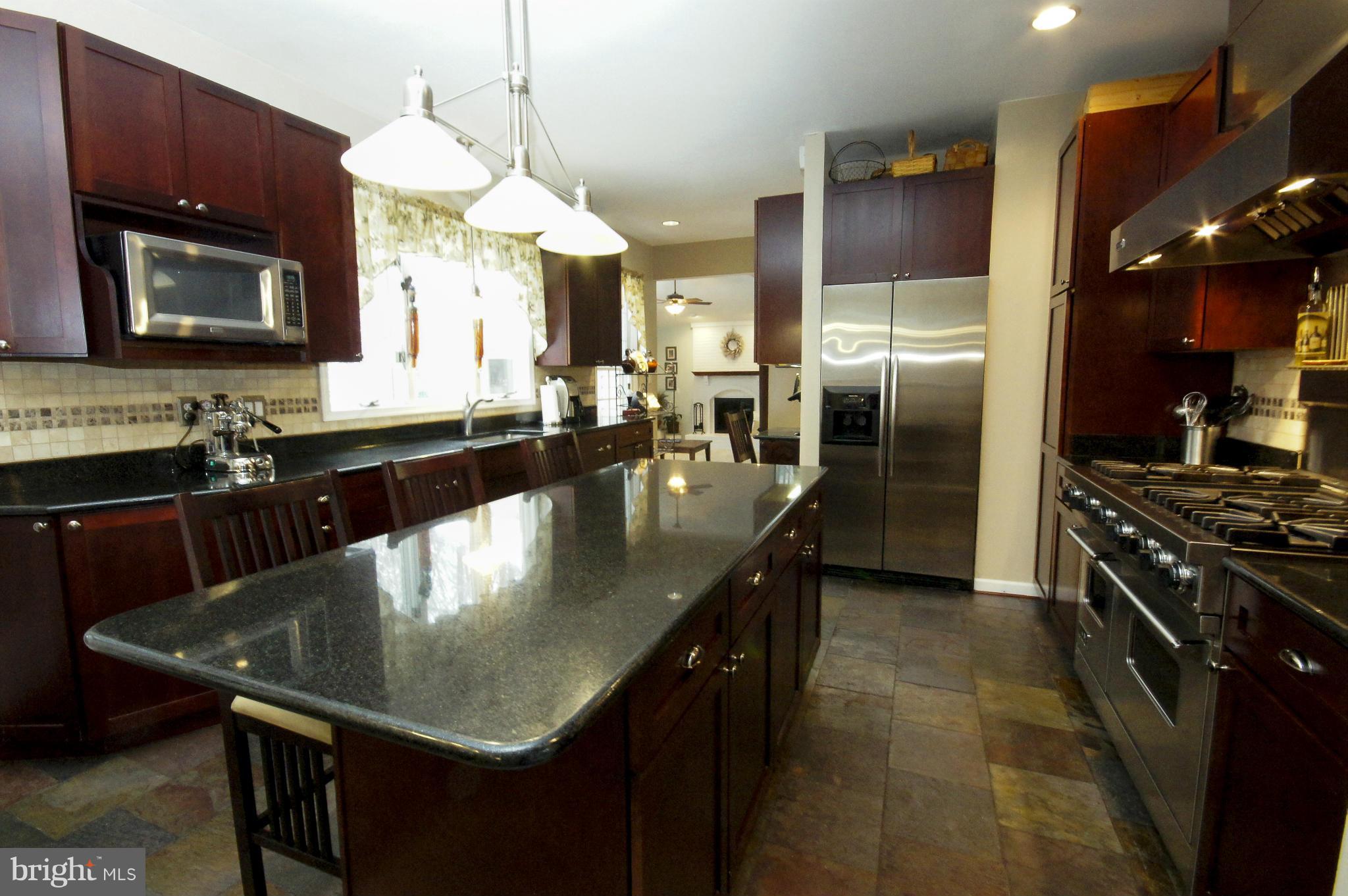 9729 Starling Road Ellicott City, MD 21042 - Photo 7 of 28 Kitchen with Granite Island and Breakfast Bar