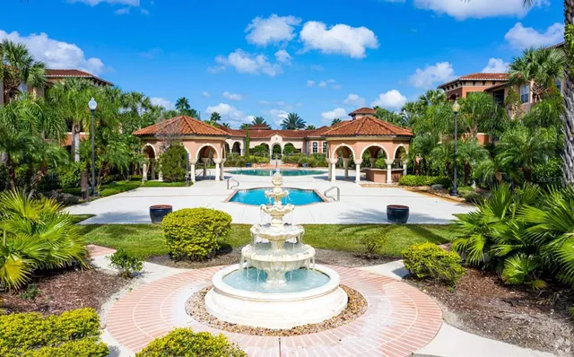a front view of a house with a yard table and chairs