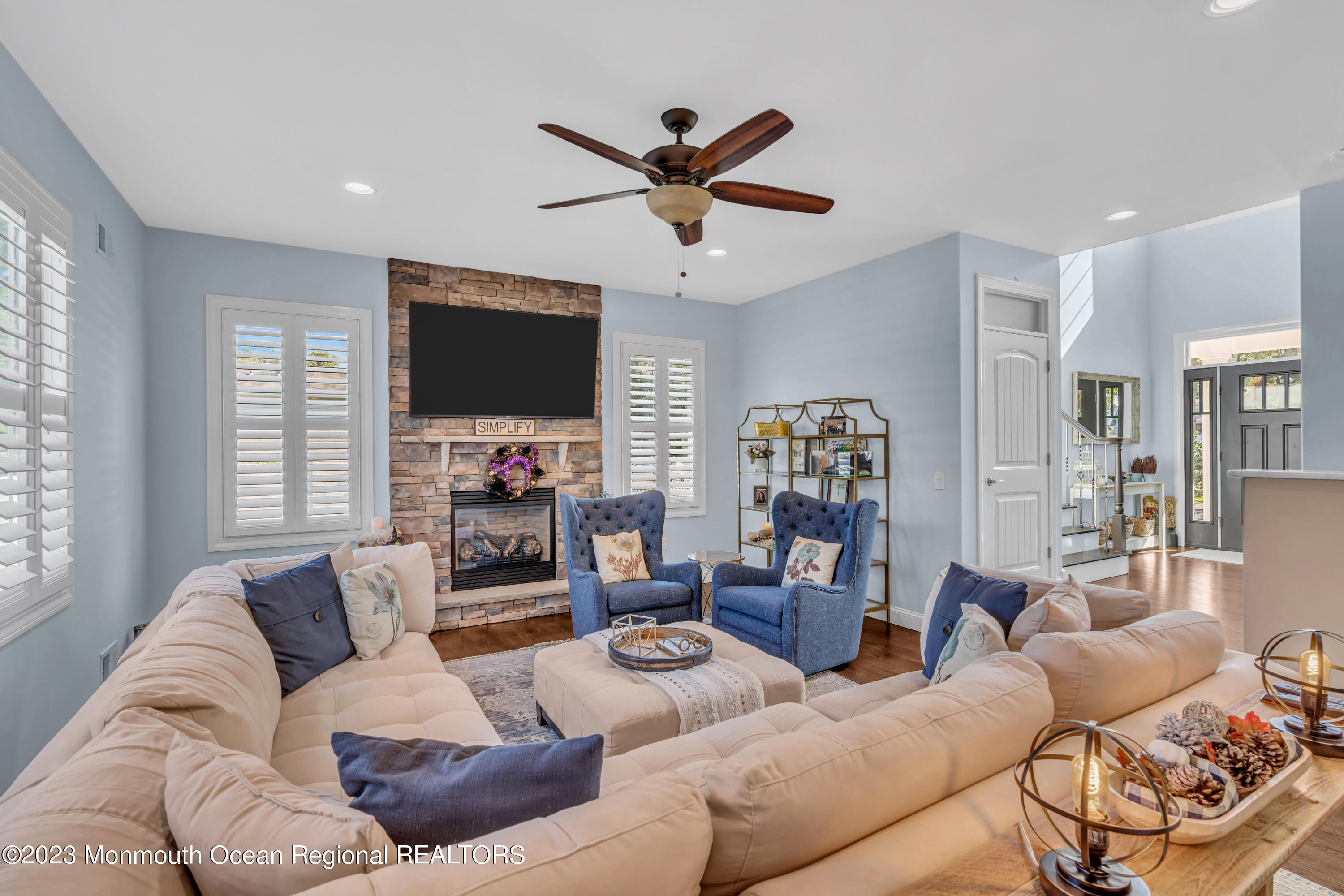 304 Wayne Avenue Pine Beach, NJ 08741 - Photo 25 of 94 a living room with furniture and a flat screen tv with wooden floor