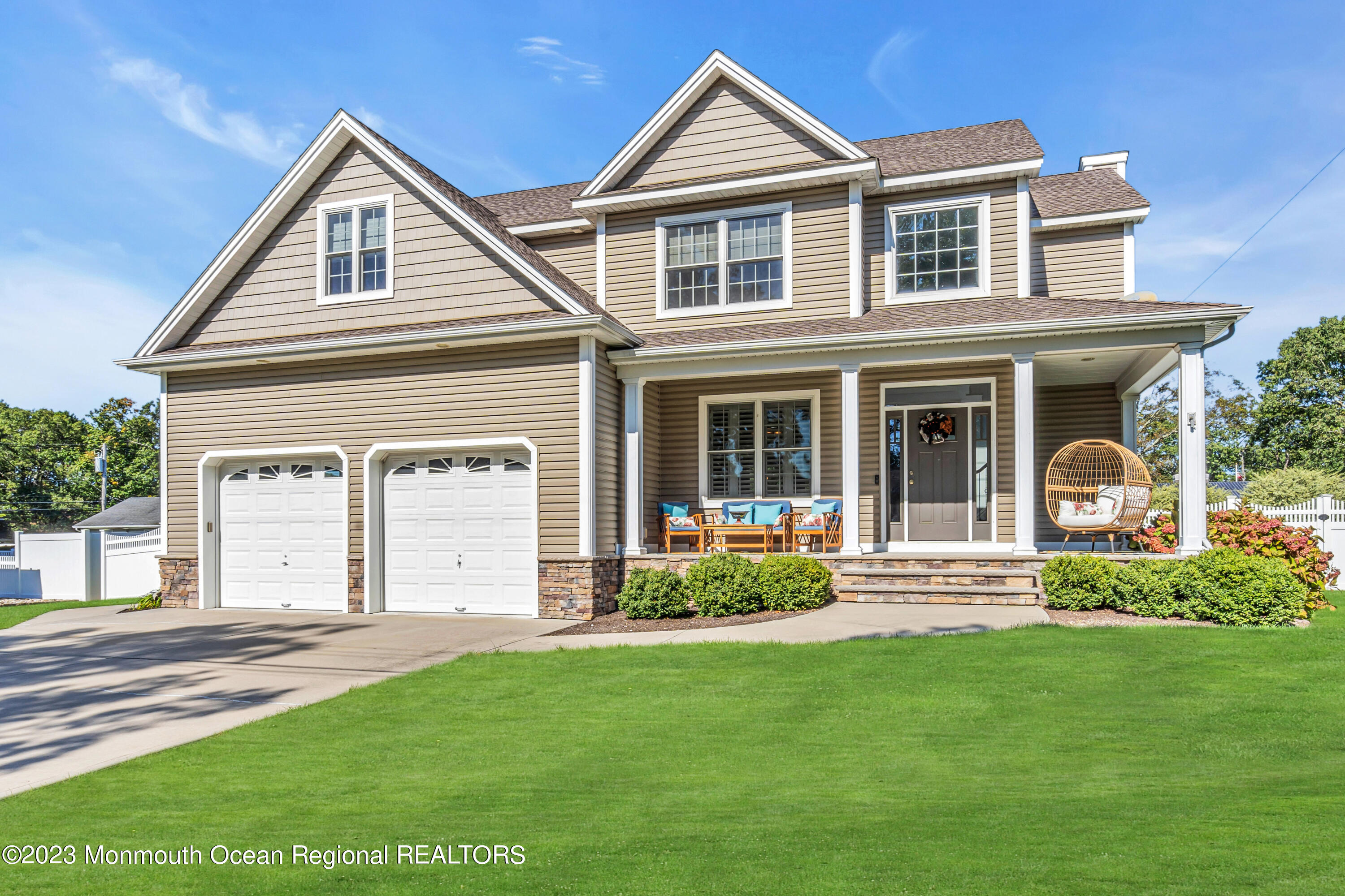 304 Wayne Avenue Pine Beach, NJ 08741 - Photo 3 of 94 a front view of a house with a yard