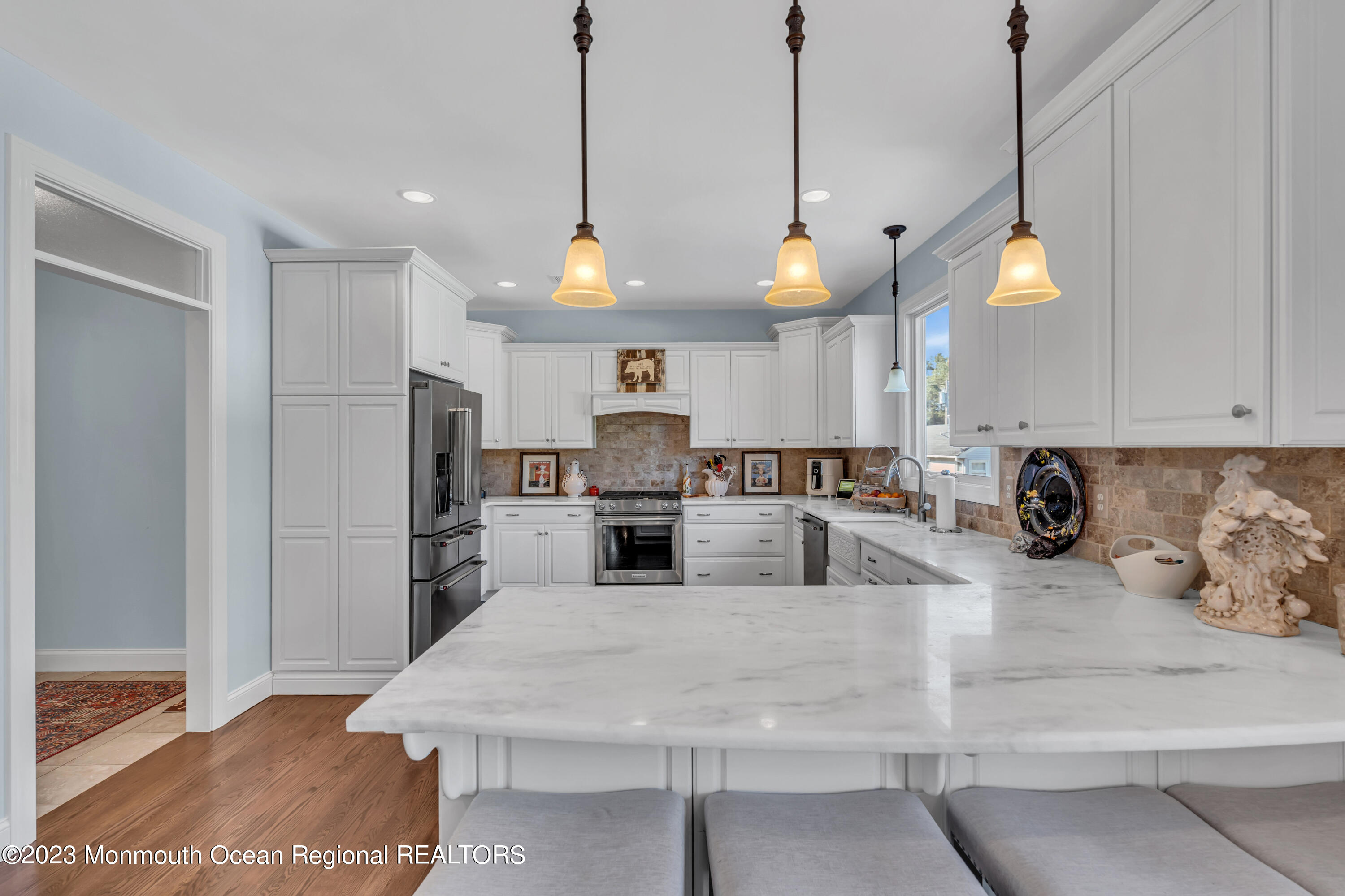 304 Wayne Avenue Pine Beach, NJ 08741 - Photo 38 of 94 a kitchen with stainless steel appliances kitchen island granite countertop a refrigerator a stove and a sink