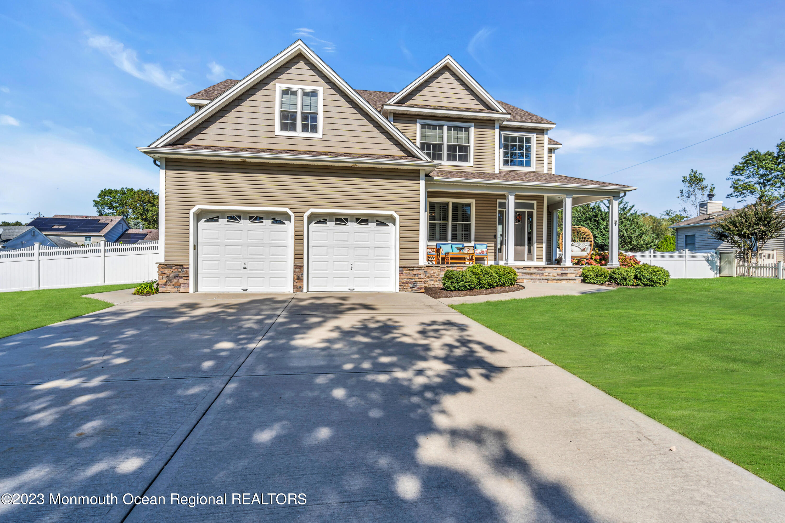 304 Wayne Avenue Pine Beach, NJ 08741 - Photo 4 of 94 a front view of a house with a yard