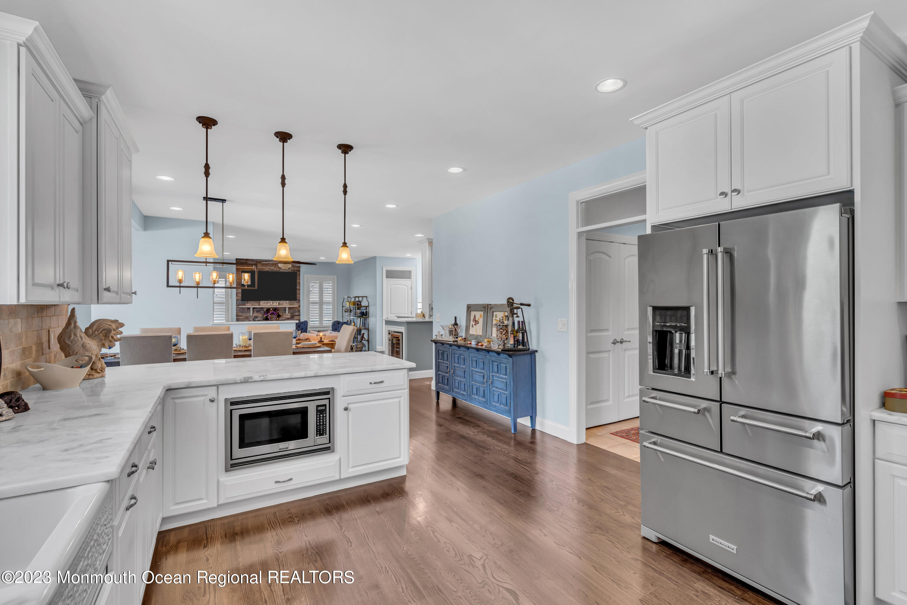 304 Wayne Avenue Pine Beach, NJ 08741 - Photo 45 of 94 a kitchen with kitchen island a white counter top space stainless steel appliances and cabinets