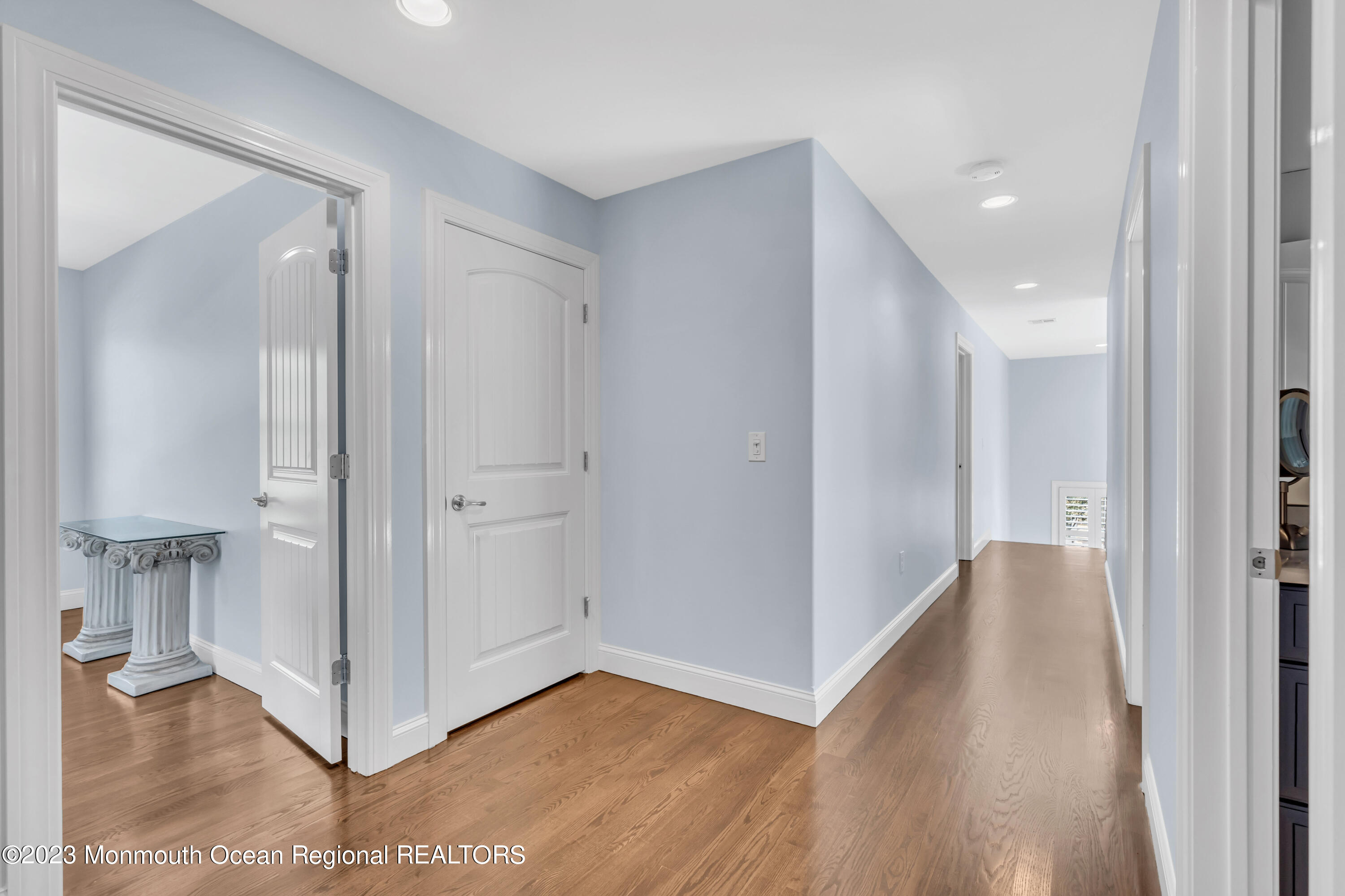 304 Wayne Avenue Pine Beach, NJ 08741 - Photo 54 of 94 a view of a hallway with wooden floor and staircase