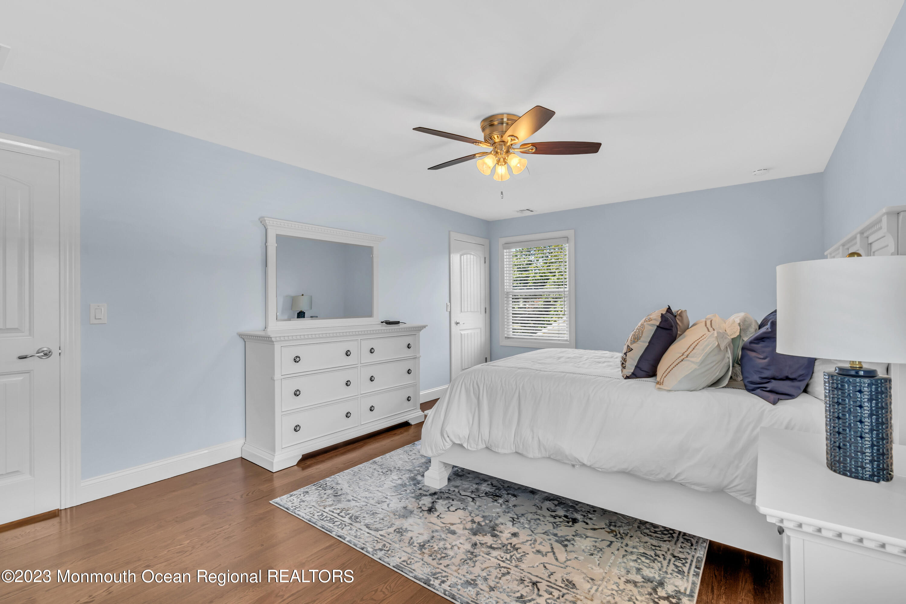 304 Wayne Avenue Pine Beach, NJ 08741 - Photo 56 of 94 a bedroom with a bed and a chandelier