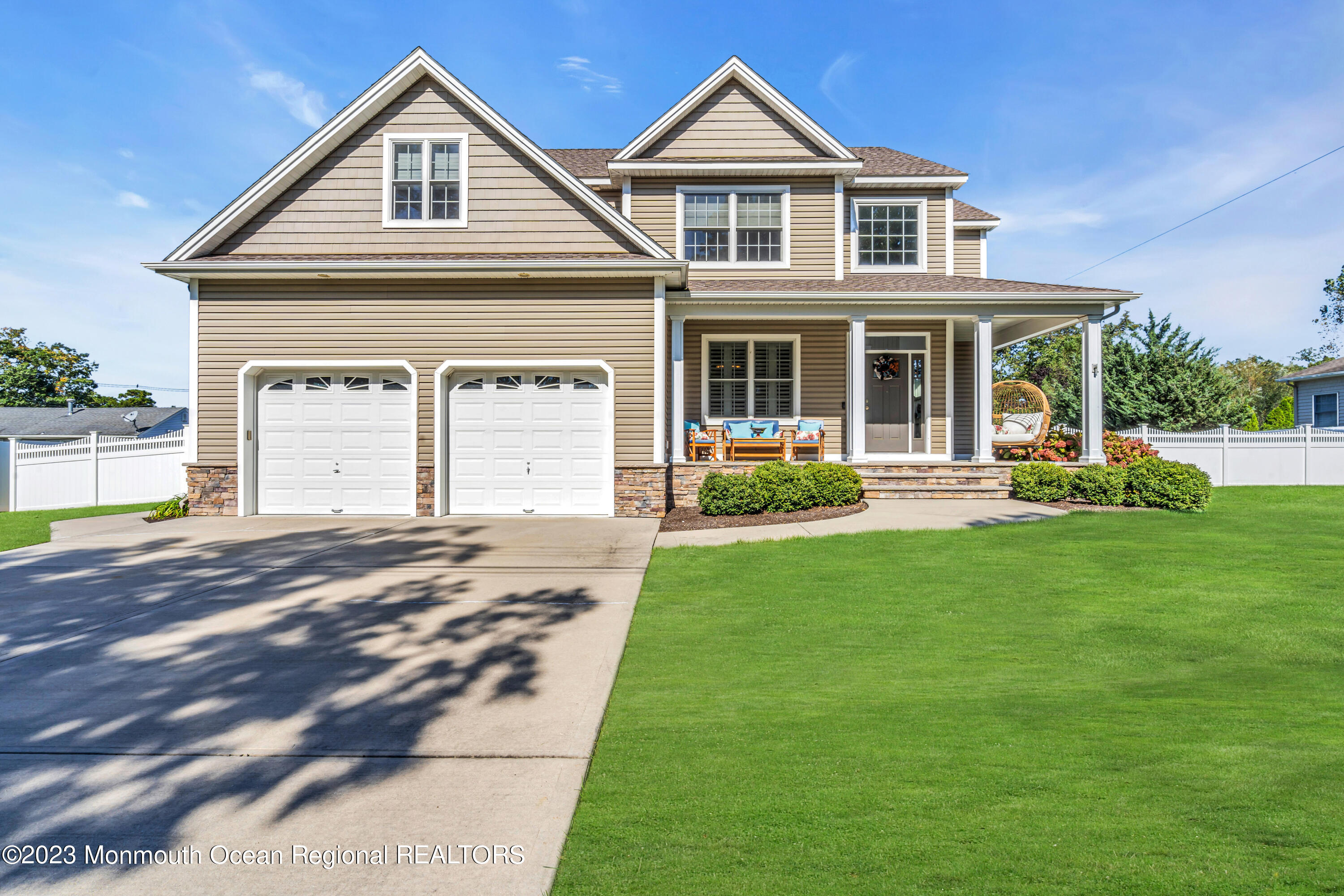 304 Wayne Avenue Pine Beach, NJ 08741 - Photo 6 of 94 a front view of a house with a yard