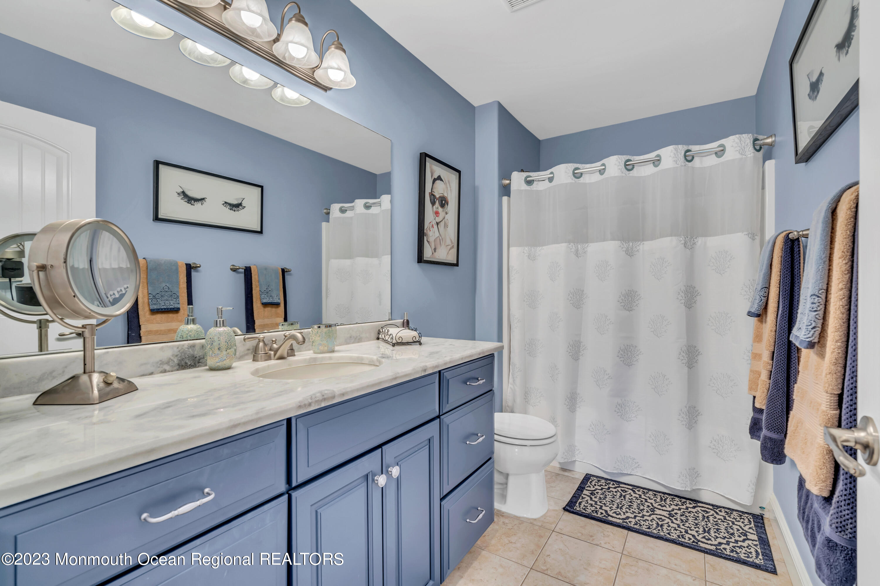 304 Wayne Avenue Pine Beach, NJ 08741 - Photo 62 of 94 a bathroom with a granite countertop sink a toilet and a mirror