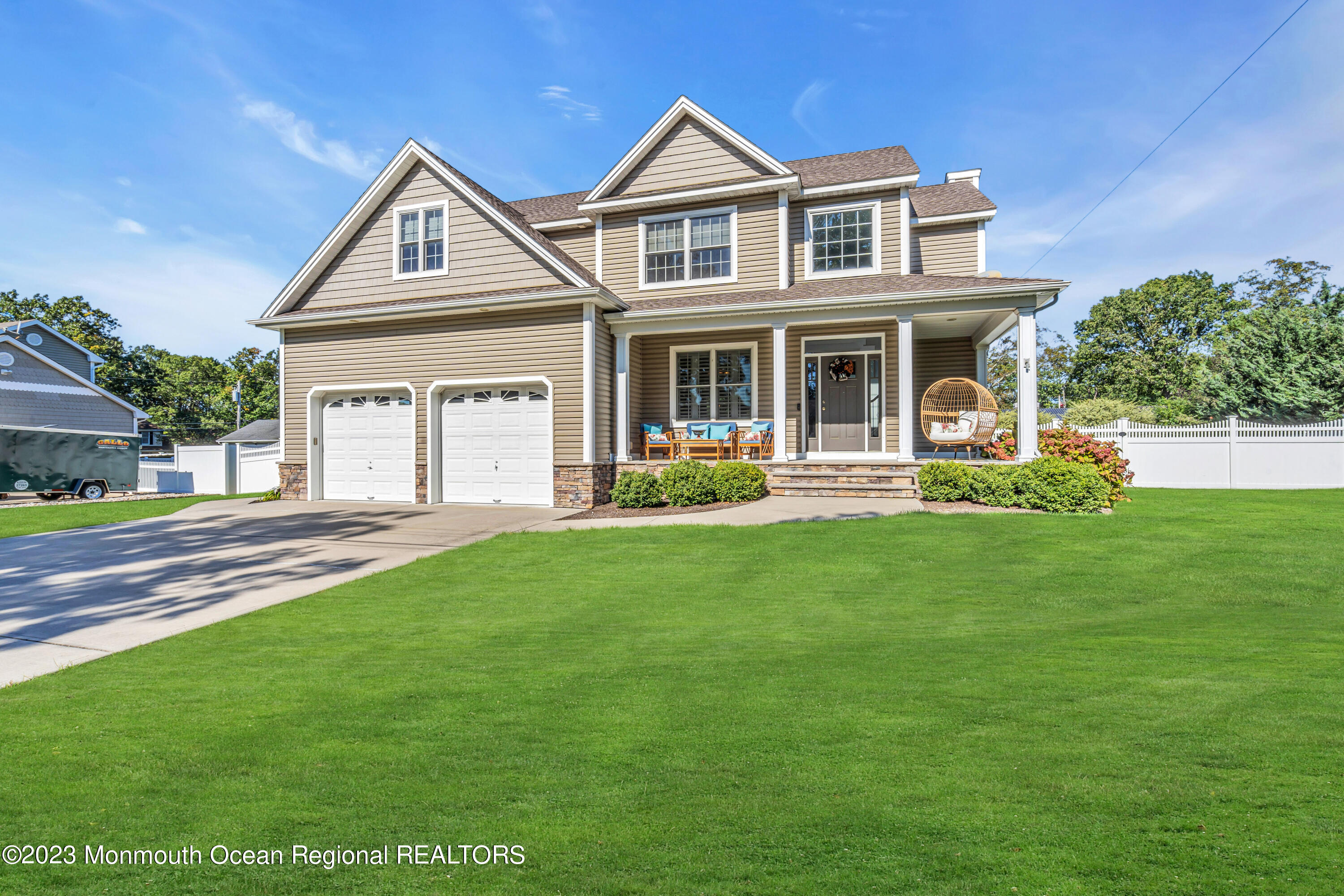 304 Wayne Avenue Pine Beach, NJ 08741 - Photo 7 of 94 a front view of a house with a yard