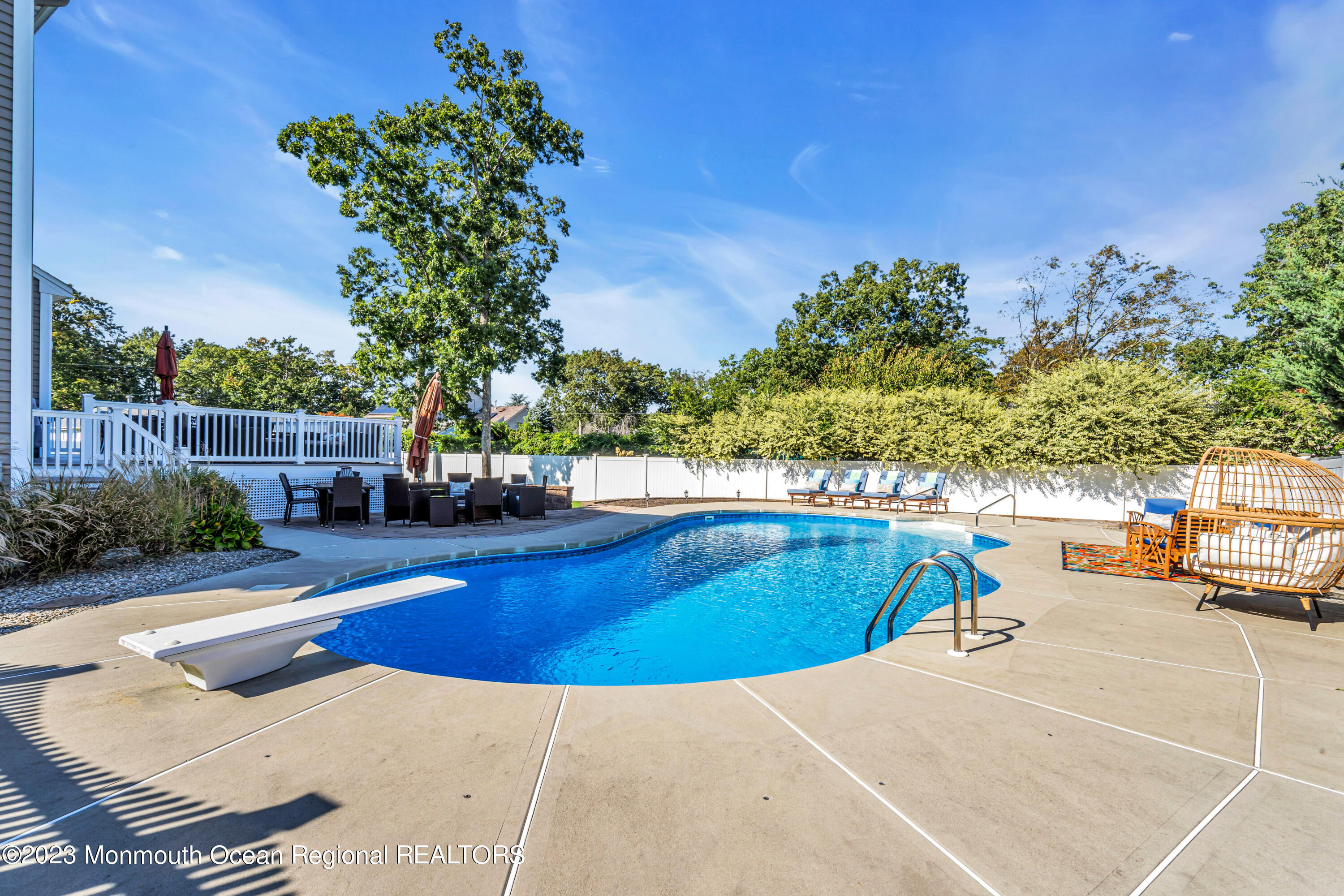 304 Wayne Avenue Pine Beach, NJ 08741 - Photo 87 of 94 a view of a swimming pool with lounge chairs