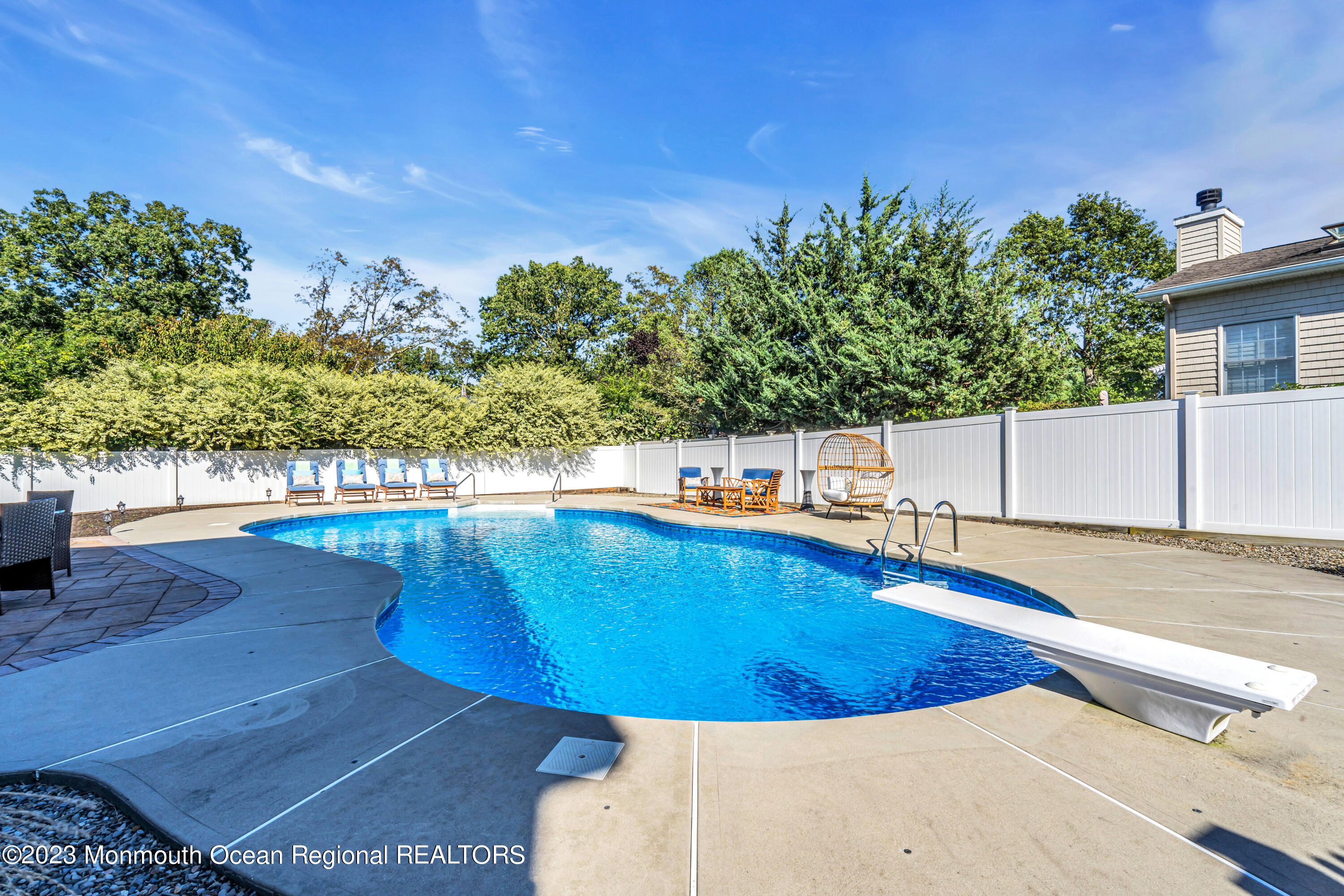 304 Wayne Avenue Pine Beach, NJ 08741 - Photo 88 of 94 a view of a swimming pool with an outdoor seating