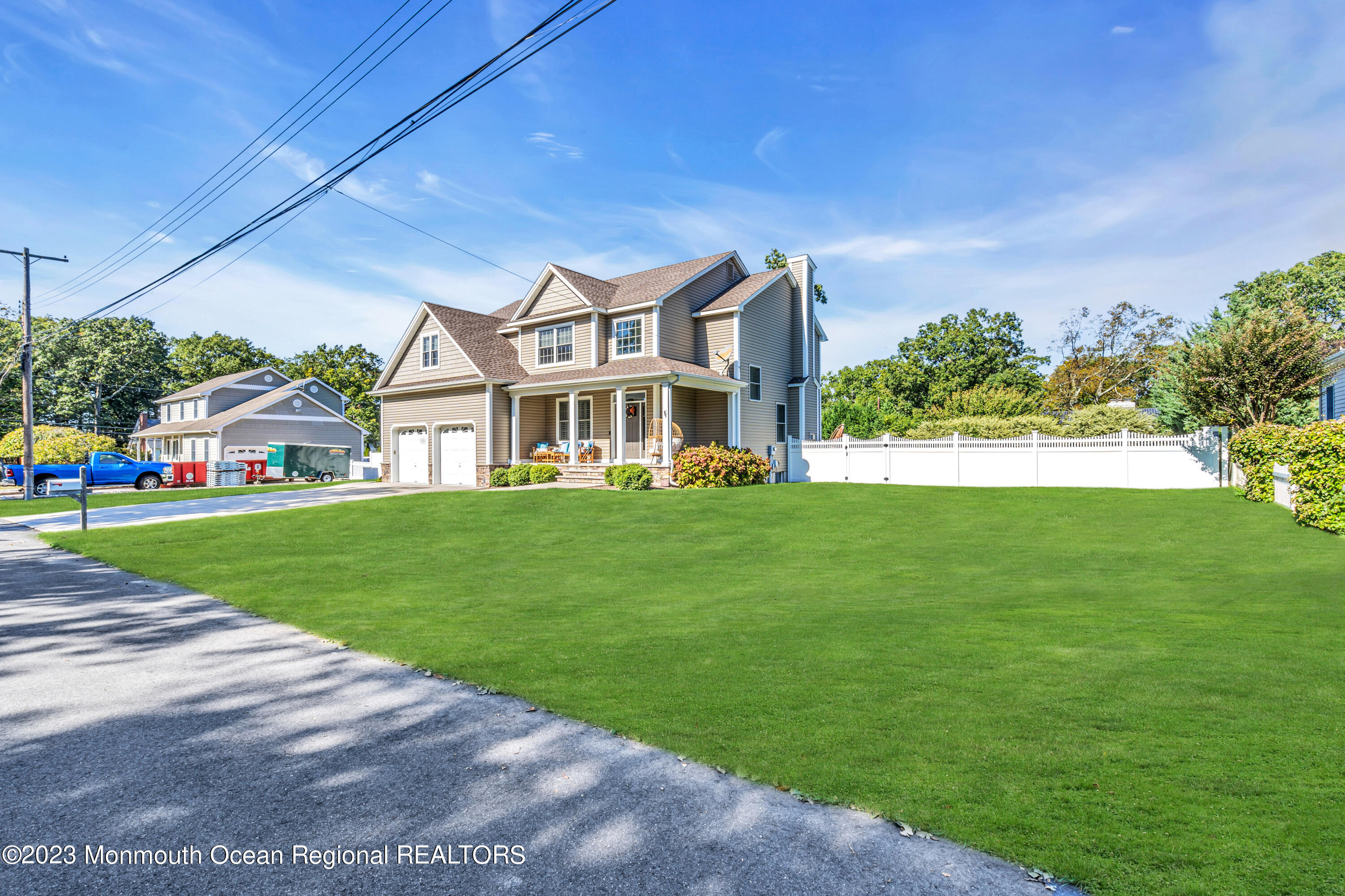 304 Wayne Avenue Pine Beach, NJ 08741 - Photo 9 of 94 a front view of a house with a yard table and chairs