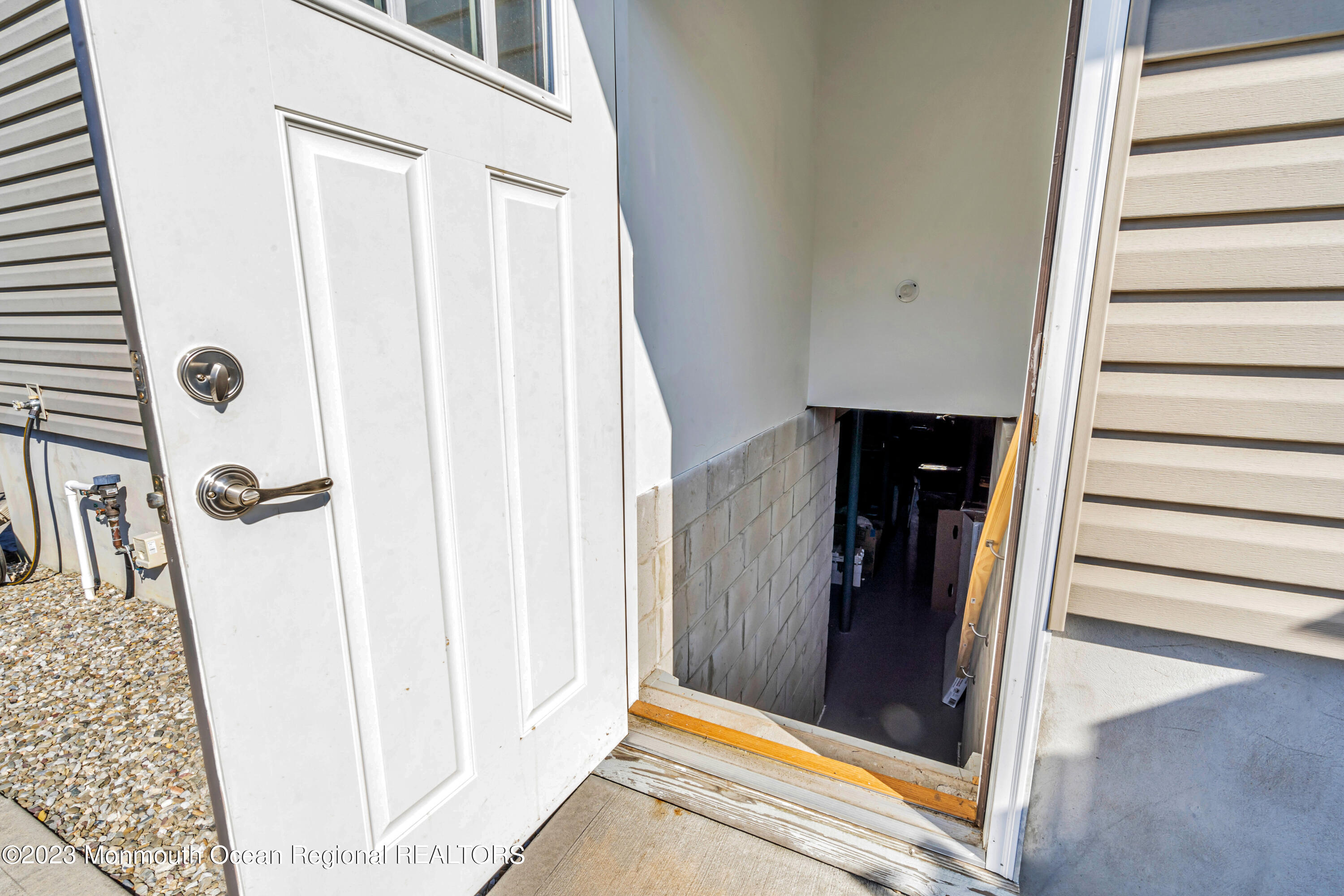 304 Wayne Avenue Pine Beach, NJ 08741 - Photo 93 of 94 a view of a hallway with wooden floor and staircase