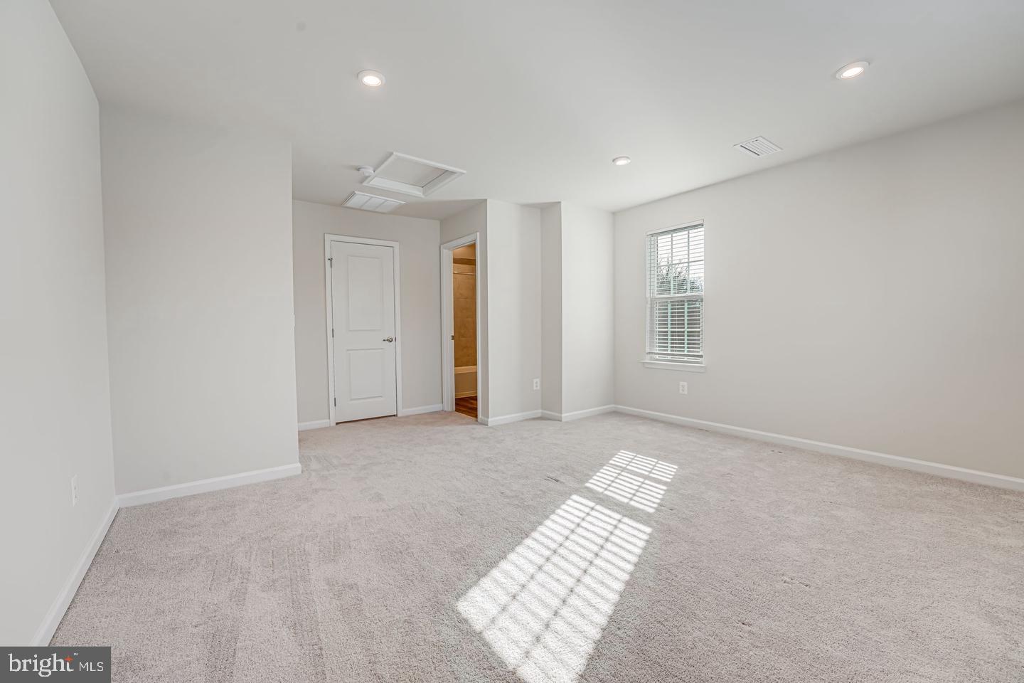 18339 Reaper Hl Court Triangle, VA 22172 - Photo 11 of 34 an empty room with windows and closet