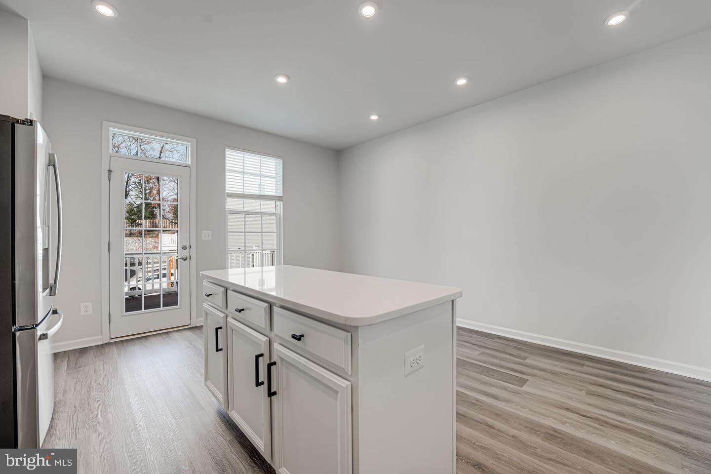 18339 Reaper Hl Court Triangle, VA 22172 - Photo 4 of 34 a hallway with windows and wooden floor