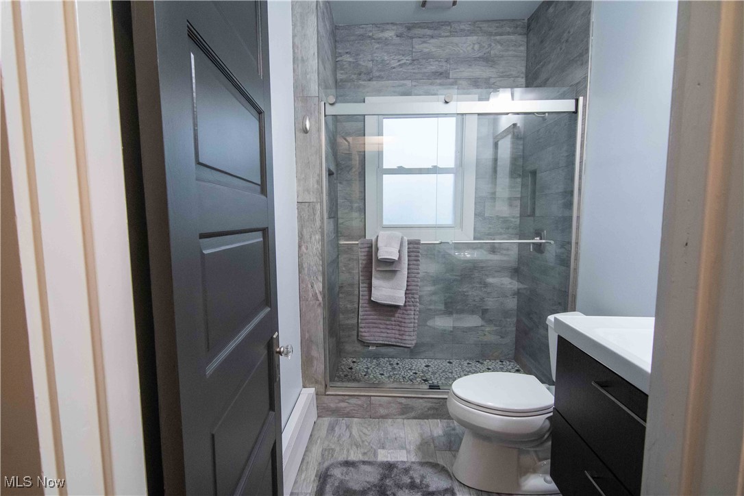 1905 Fulton Road, Unit 3A Cleveland, OH 44113 - Photo 25 of 34 Full bathroom featuring a shower stall, toilet, and vanity