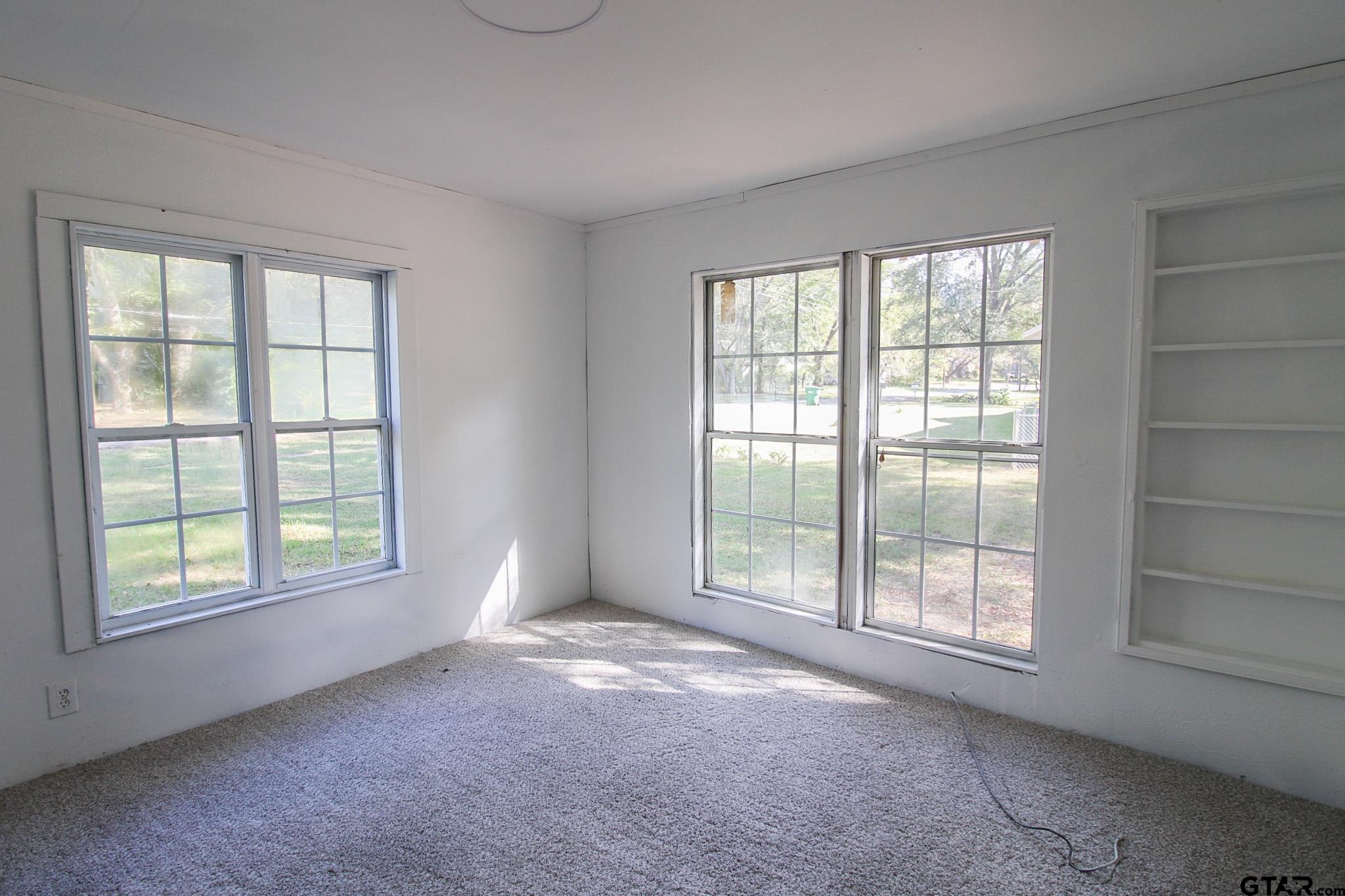 407 Pace Street Naples, TX 75568 - Photo 17 of 31 an empty room with windows