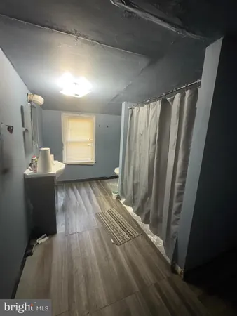 a view of a storage & utility room with closet window