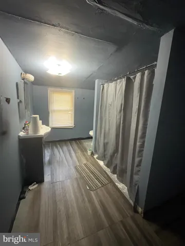 a view of a storage & utility room with closet window