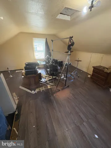 a living room with hard wood flooring and furniture