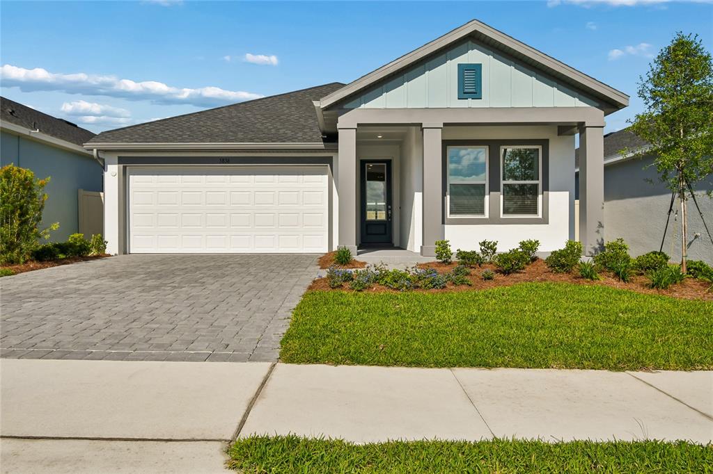 5836 Native Oak Street Mount Dora, FL 32757 - Photo 1 of 39 a front view of house with yard