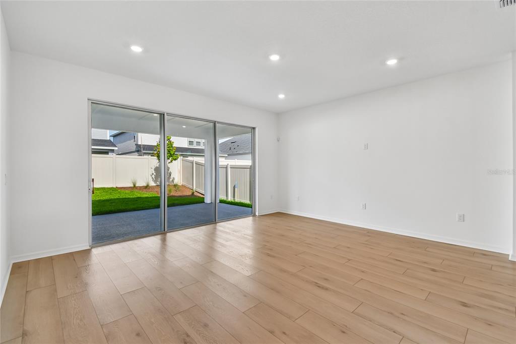 5836 Native Oak Street Mount Dora, FL 32757 - Photo 11 of 39 a view of room with wooden floor
