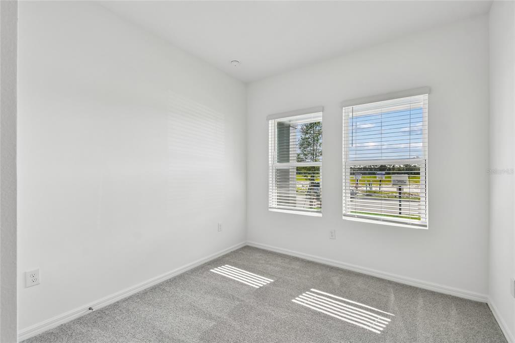 5836 Native Oak Street Mount Dora, FL 32757 - Photo 23 of 39 an empty room with windows