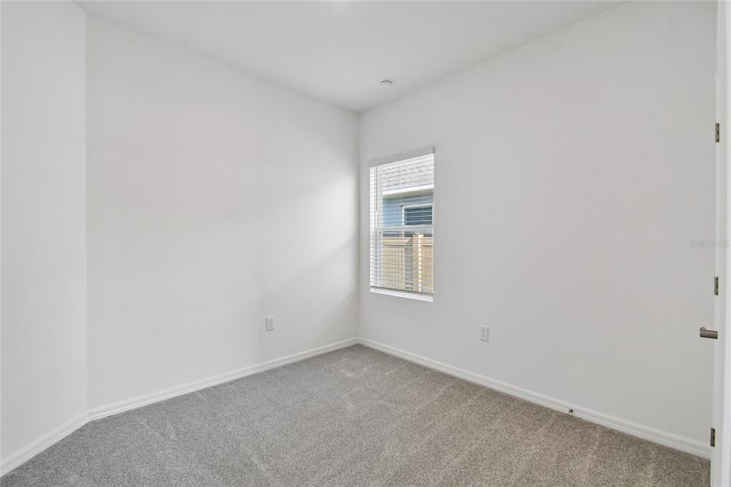 5836 Native Oak Street Mount Dora, FL 32757 - Photo 26 of 39 an empty room with a window