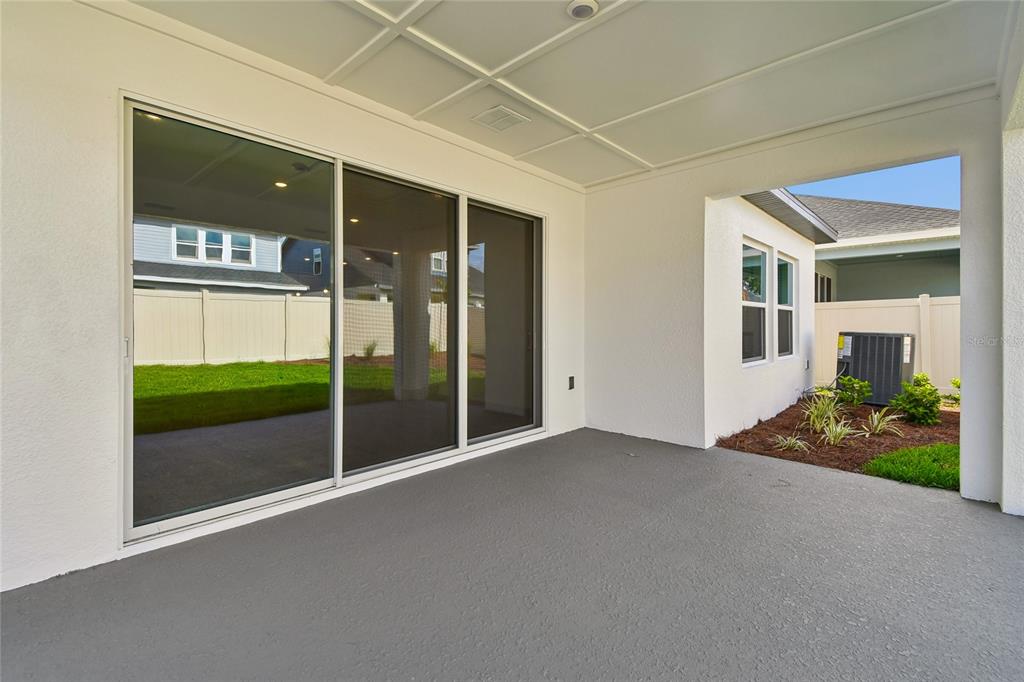 5836 Native Oak Street Mount Dora, FL 32757 - Photo 29 of 39 a view of a room with wooden floor and entryway