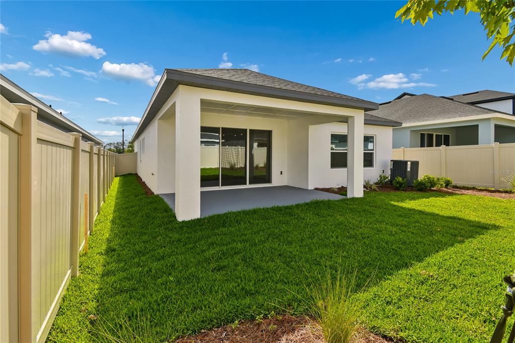 5836 Native Oak Street Mount Dora, FL 32757 - Photo 35 of 39 a view of a house with backyard