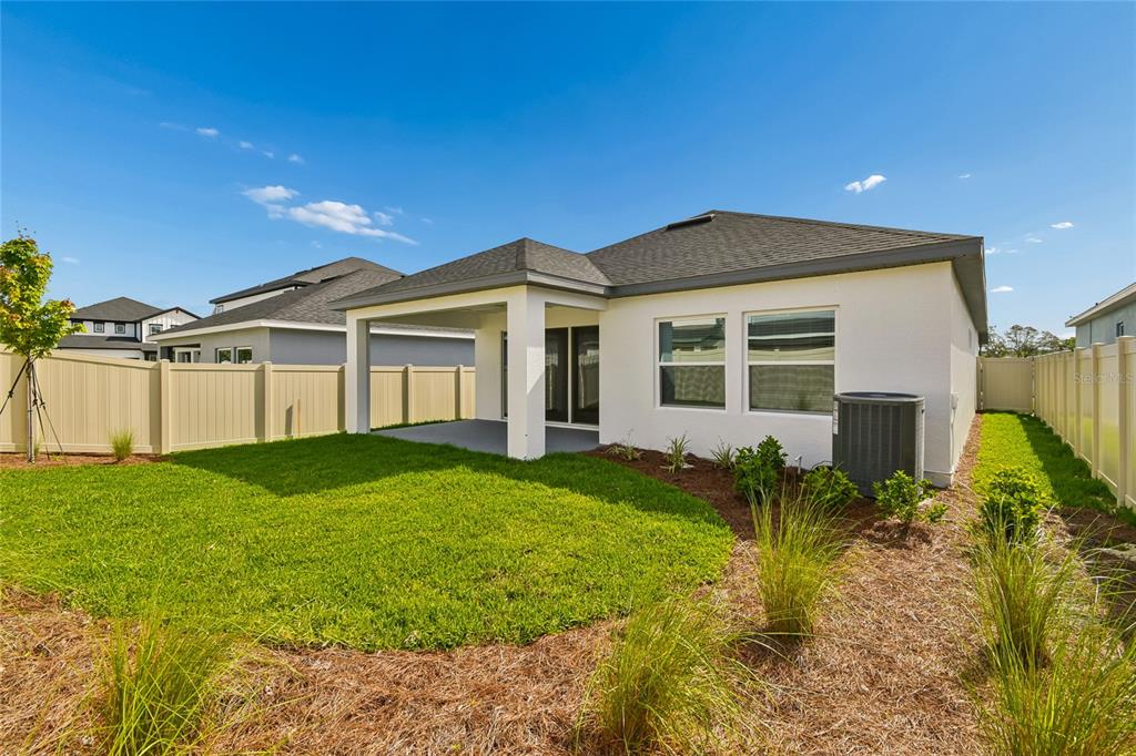 5836 Native Oak Street Mount Dora, FL 32757 - Photo 36 of 39 a view of a house with backyard