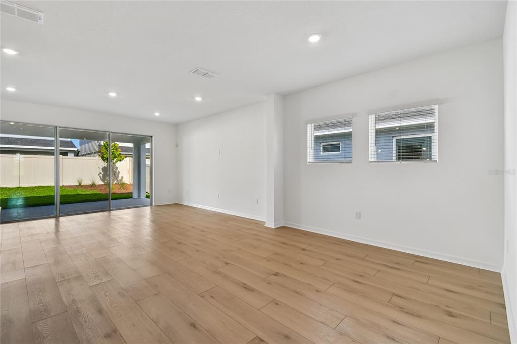 5836 Native Oak Street Mount Dora, FL 32757 - Photo 8 of 39 a view of an empty room with a window
