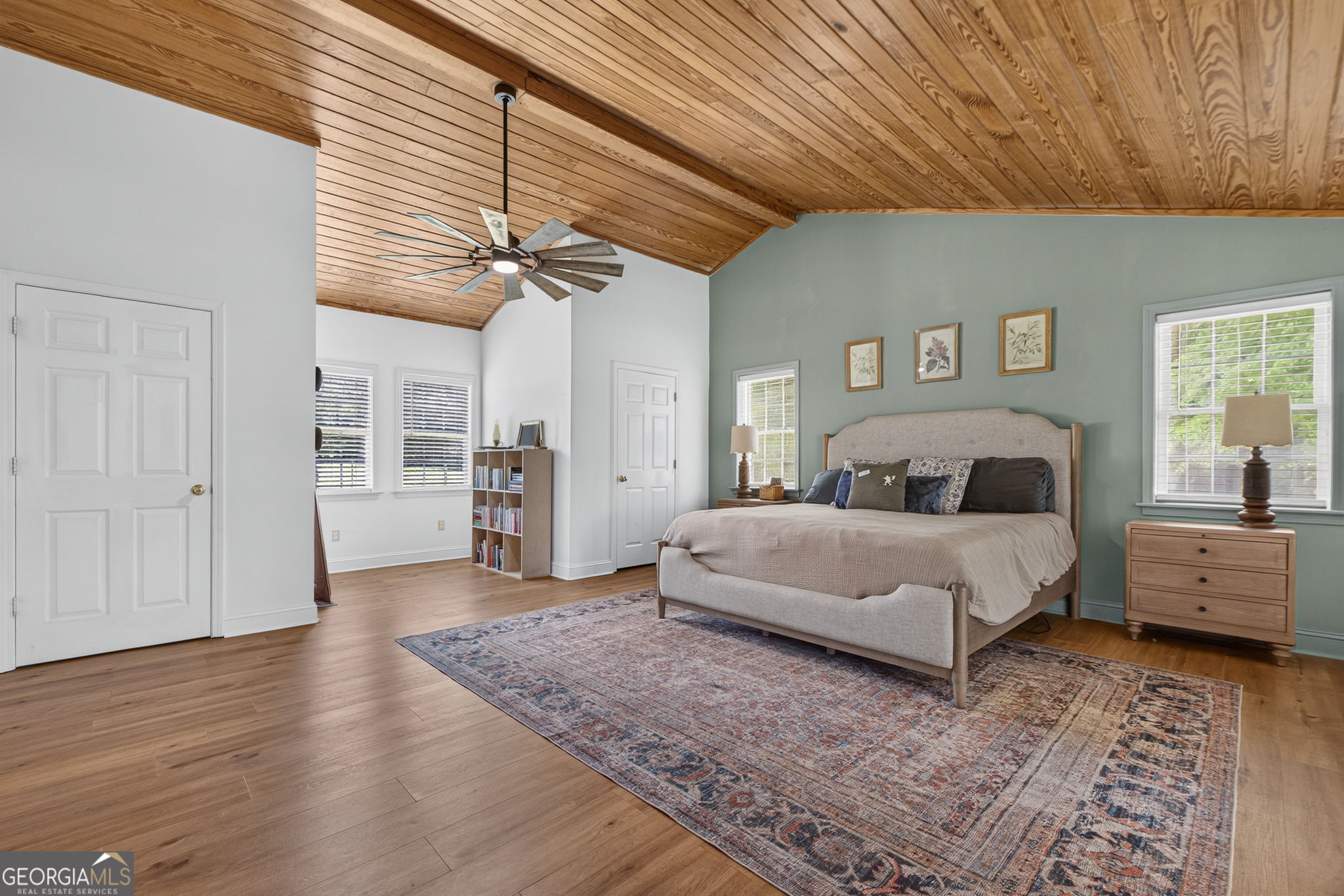 242 Harris Road Concord, GA 30206 - Photo 24 of 55 a spacious bedroom with a large bed a chandelier and closet