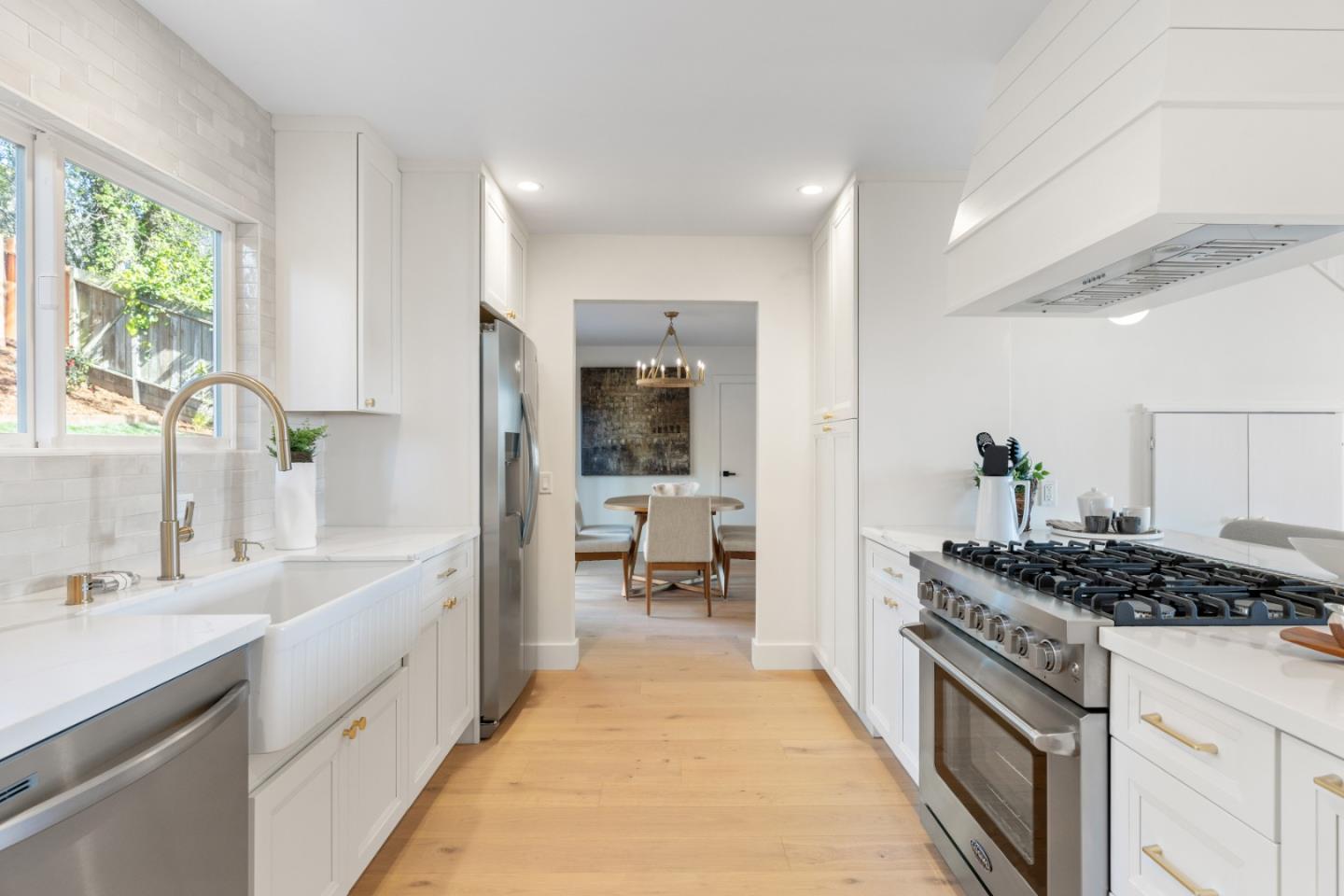 309 Channing Way Pacifica, CA 94044 - Photo 15 of 42 a kitchen with stainless steel appliances a sink stove and cabinets