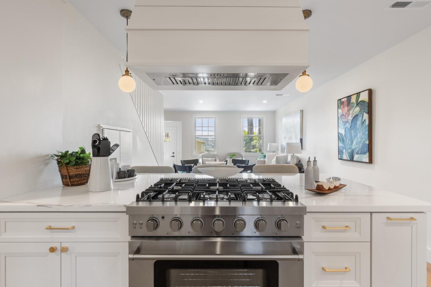 309 Channing Way Pacifica, CA 94044 - Photo 17 of 42 a kitchen with a stove and cabinets