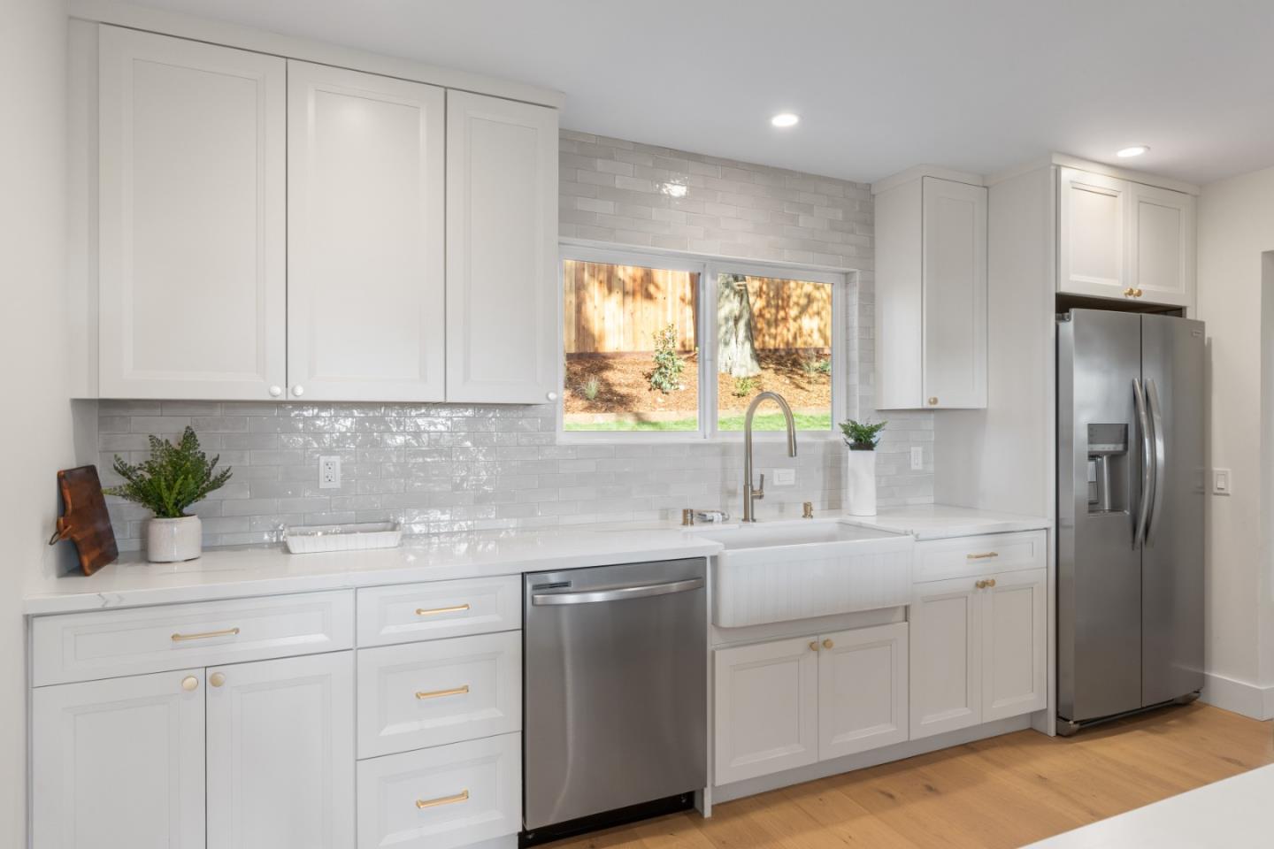 309 Channing Way Pacifica, CA 94044 - Photo 18 of 42 a kitchen with a sink dishwasher a refrigerator and cabinets